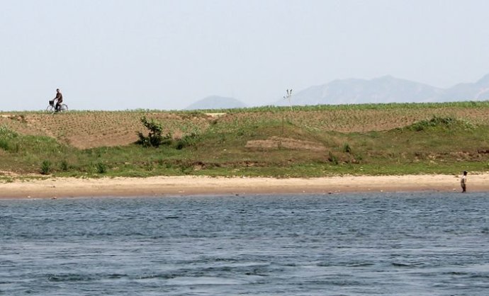 中朝边境美丽的风景,中朝边境桃花盛开的地方