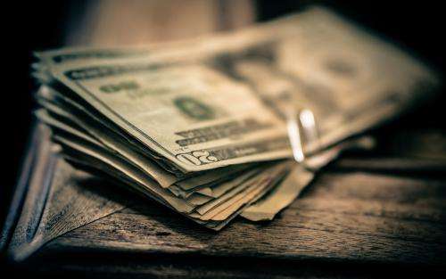 为什么国际石油都是美元交易,石油用美元结算是什么时候开始的