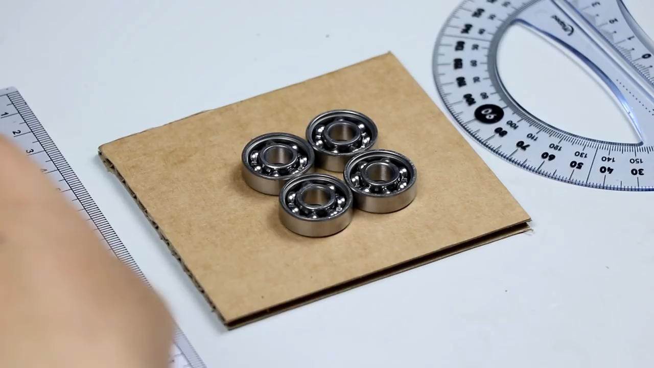 怎么用瓶盖做炫酷的陀螺,风火轮陀螺怎么做