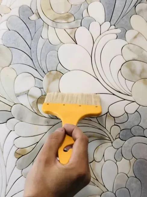 椭圆形石材马赛克拼花图案,河北地面马赛克水刀拼花施工安装