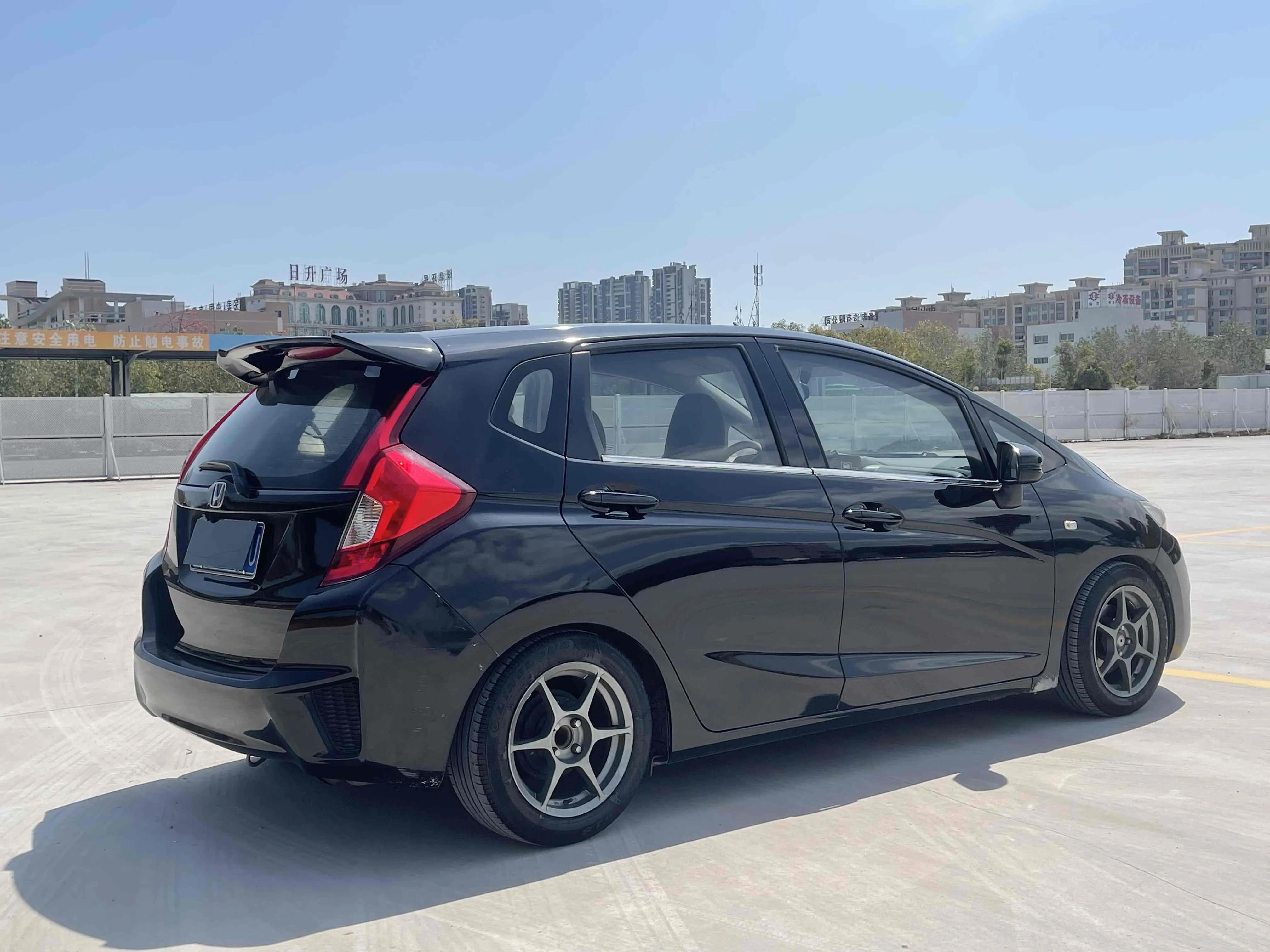 飞度2014款1.5cvtexli领先版价格,本田飞度09款1.3l图片