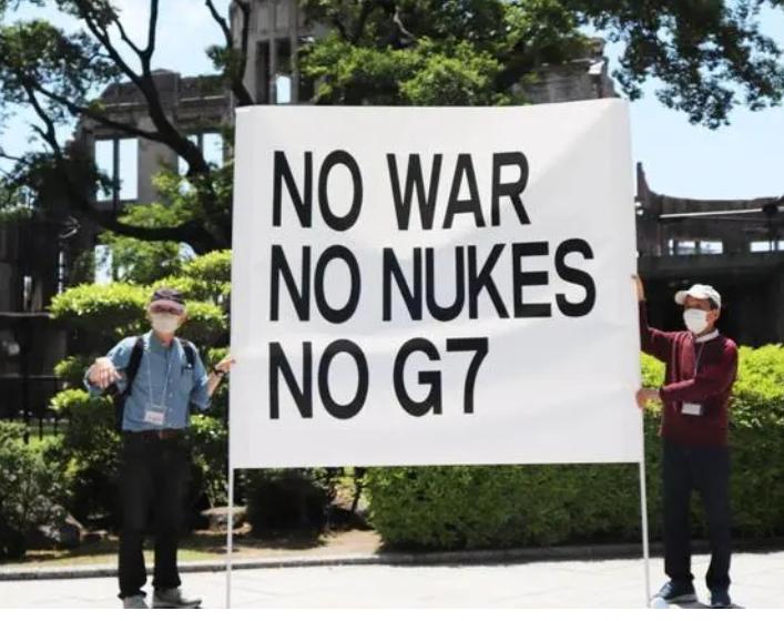 日本民众冒雨反对G7峰会,日本广岛举行g7峰会安全演习