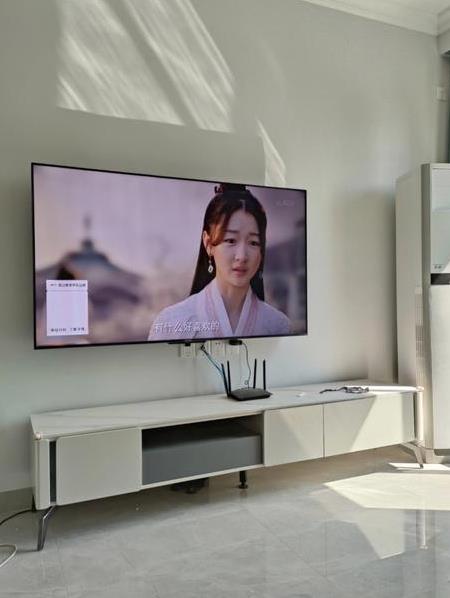 装修选电视机还是投影仪,客厅装修用多大电视合适