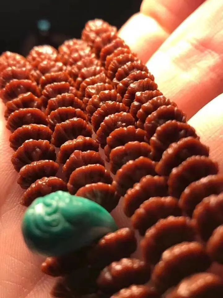 李子果核手串包浆玉化的效果,蛤蟆头核桃手串包浆玉化图片